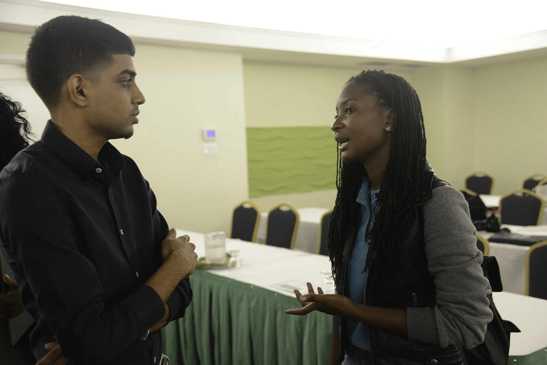 Ravin Singh, journalist Guyana Chronicle, in discussion  with  Alecia Clarke of the UTech Journalism Society.