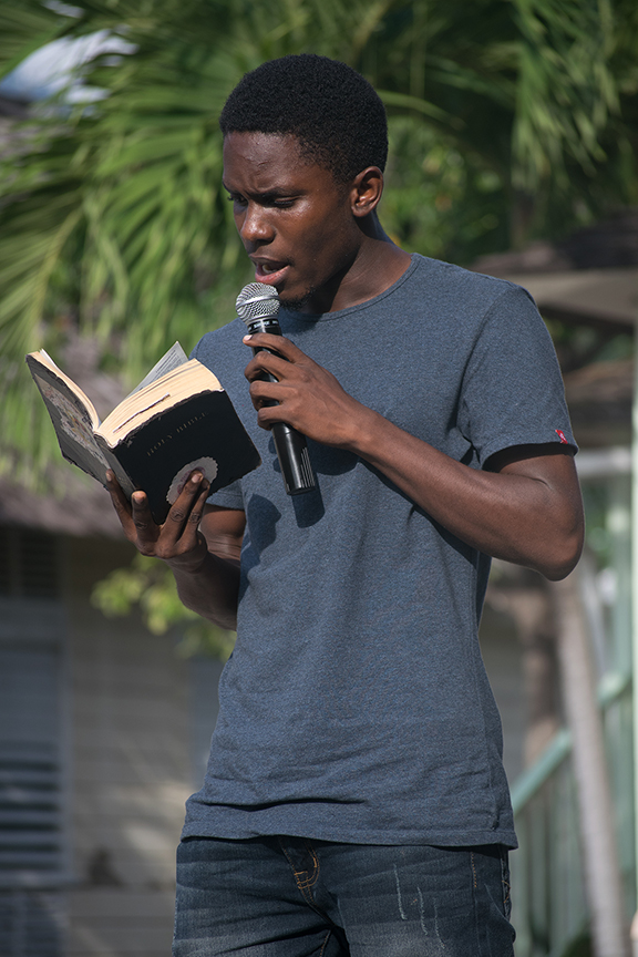 UTech, Ja. student Marvin Bloomfield opening the Island Praise in the Park gospel concert with a scripture reading.October 6, 2016