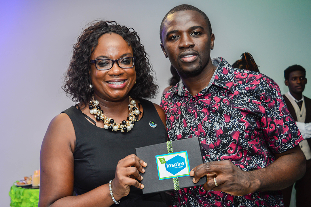 Nadine Newsome, Sagicor’s Public Relations Manager poses with Derrick Saddler, United Theological College of the West Indies student, at the Inspire Project inaugural cocktail event at the new Toyota Showroom on October 7, 2016.