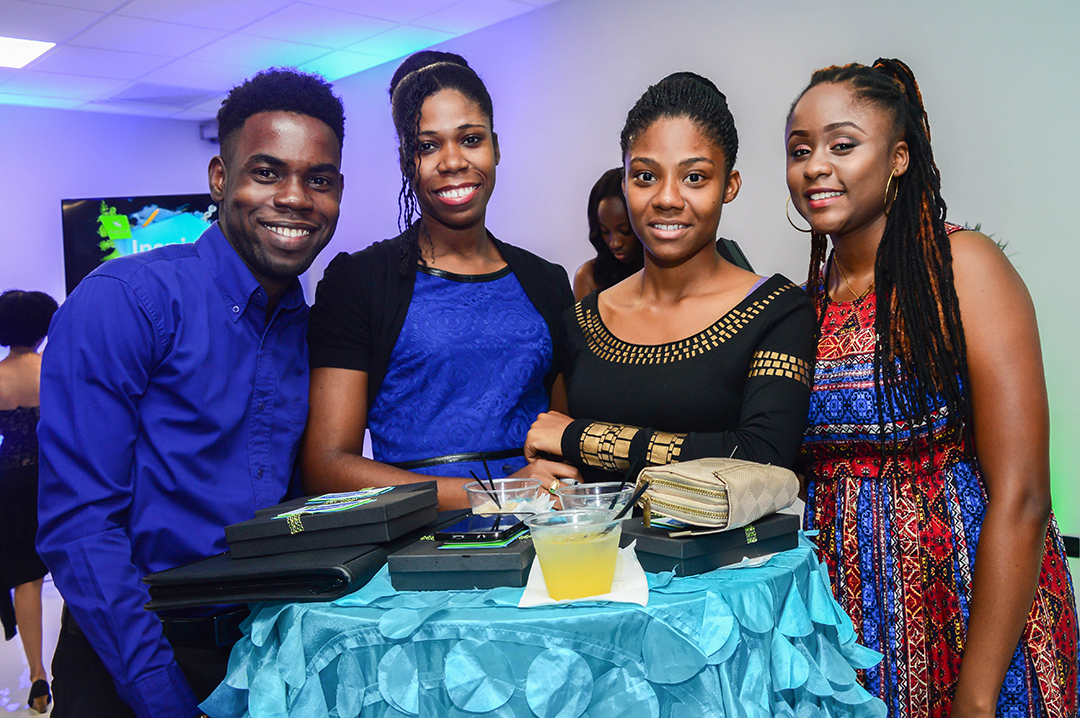 From left: Stephen Francis, Samoya Smith, Neve-Ann Smith and Brittanni Walfall, specially selected students from the University of Technology, Jamaica, enjoy a moment at Sagicor’s Inspire Project inaugural cocktail event at the new Toyota Showroom on October 7, 2016.