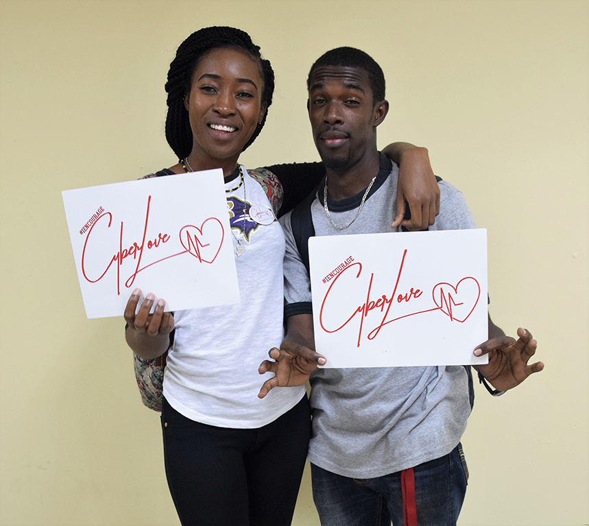 Rasneash Matthews [Left] and Jonnoy Powell [Right] pose for the camara at the Cyber Love Campaign held at the University of Technology, Jamaica on March 08, 2018. 