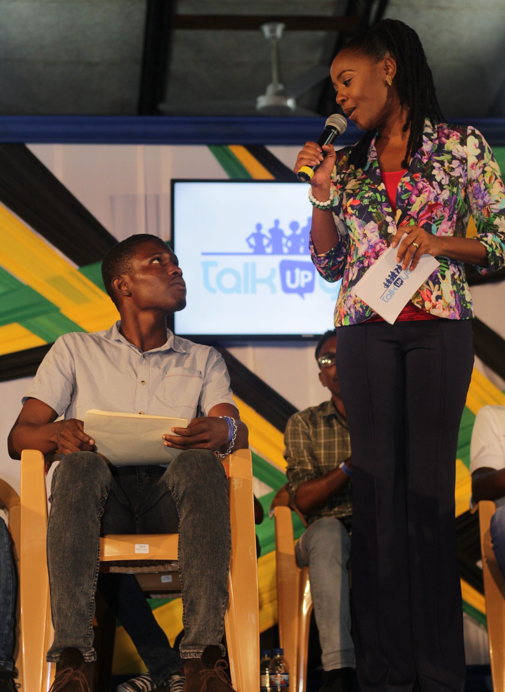 'Talk Up Yout’ Founder and Co-Executive Producer, Emprezz Golding engages with a student during an ice-breaker prior to the start of the town hall meeting for the “Youth Development Through Dialogue” held at Campion College on November 9 2018. Photo by Tatyana Atkinson/UJS News