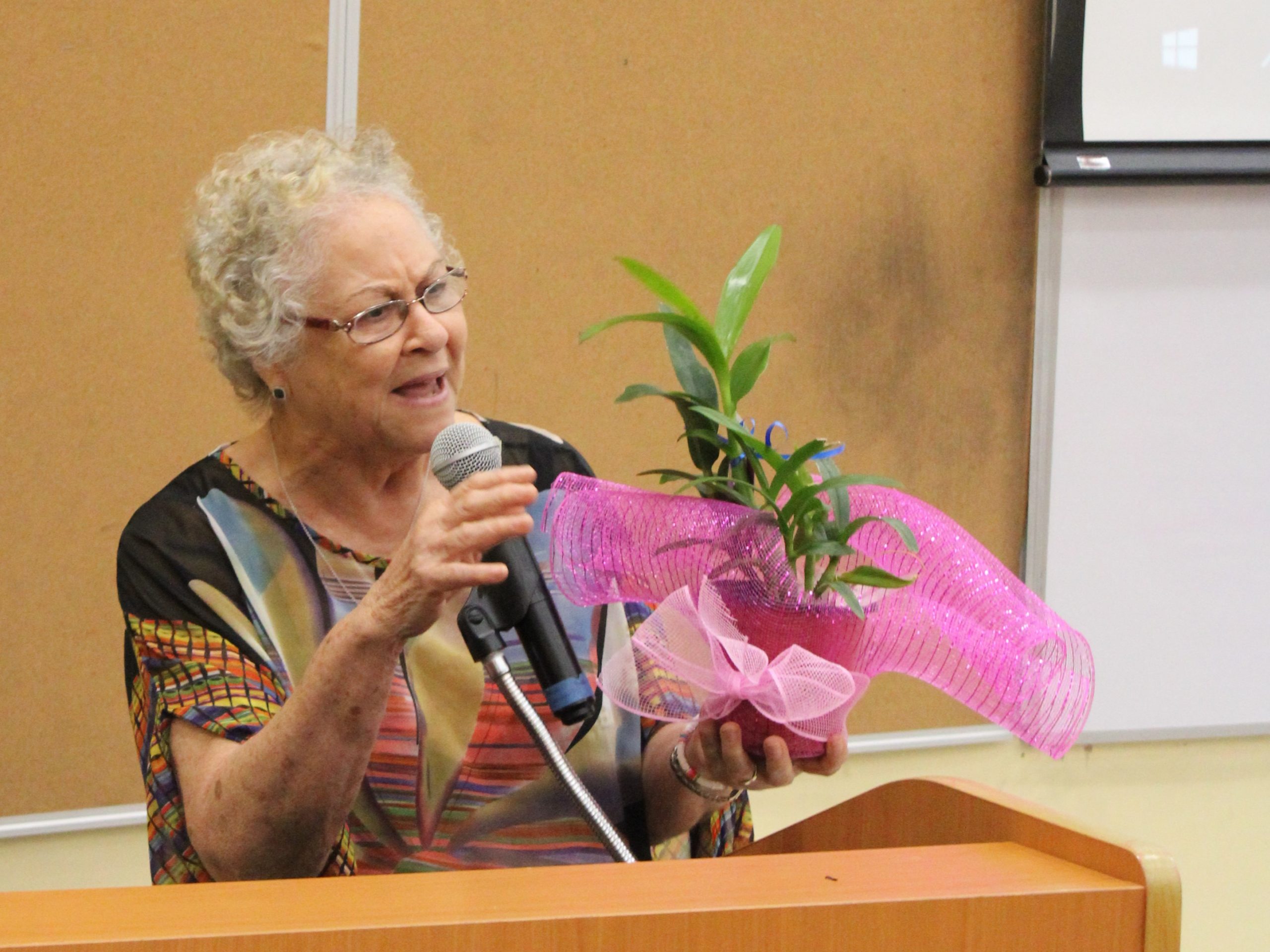 Mrs. H Pamela Kelly showcases her orchid that she was gifted with at the 9th Hilory Pamela Kelly Distinguished Lecture, at the University of Technology, Jamaica on January 26, 2023. Photo by Jessica Dunbar