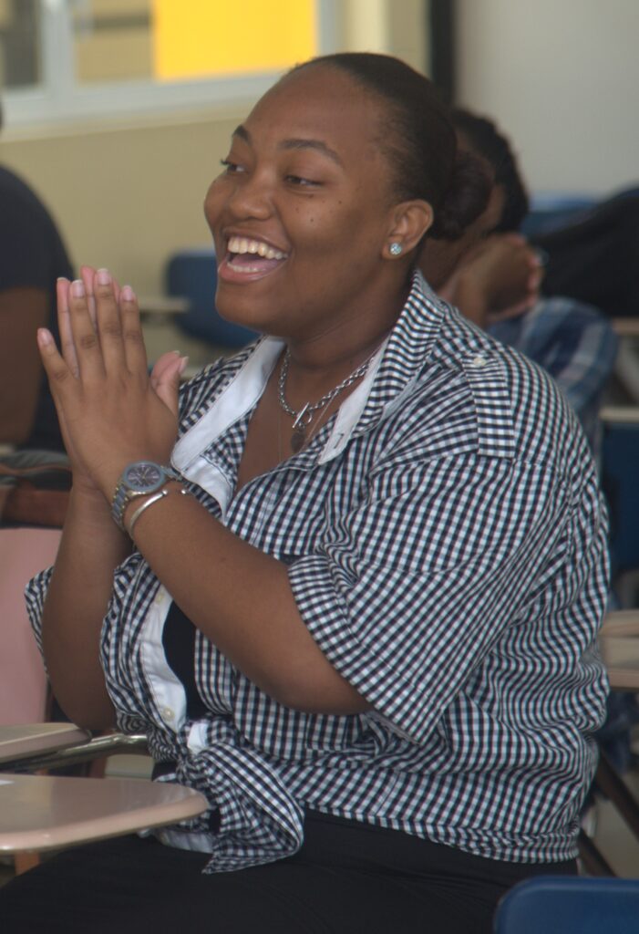 Kishana Webb directs a direct to Raymond Pryce during a students' panel interview at the University of Technology, Jamaica on March 14, 2024.