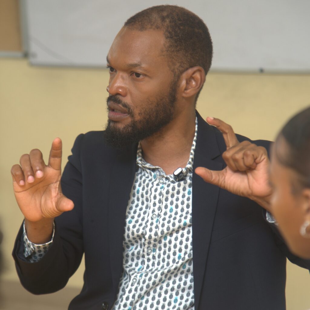 Raymond Pryce makes a point during a panel discussion with journalism students at the University of Technology, Jamaica on March 14, 2024.